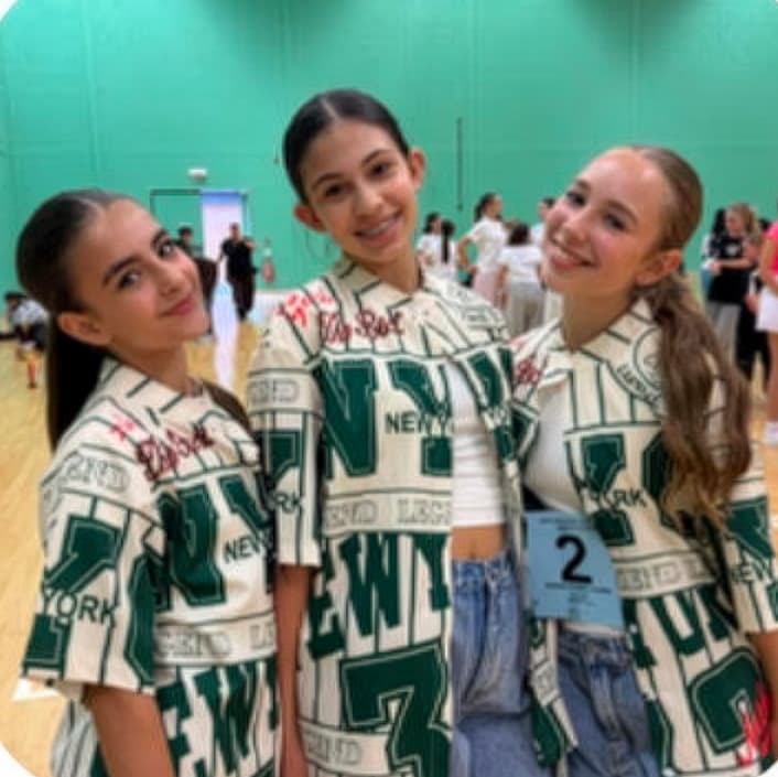 Three young HK dancers at a competition