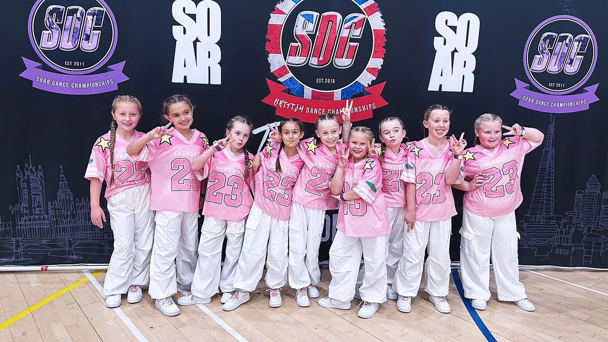 Dionne Dalton greeting young children at the door of HK Dance Studios Billericay, children in leggings and t-shirts ready for their first dance class